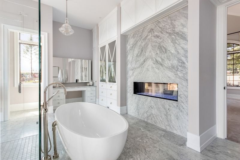 luxury bathroom with impressive design having bath tub on the center