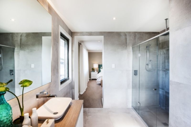 bathroom next to the bedroom with crystal shower area